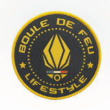 Patch velcro Boule de Feu Lifestyle noir et or diamètre 10 cm avec logo brodé